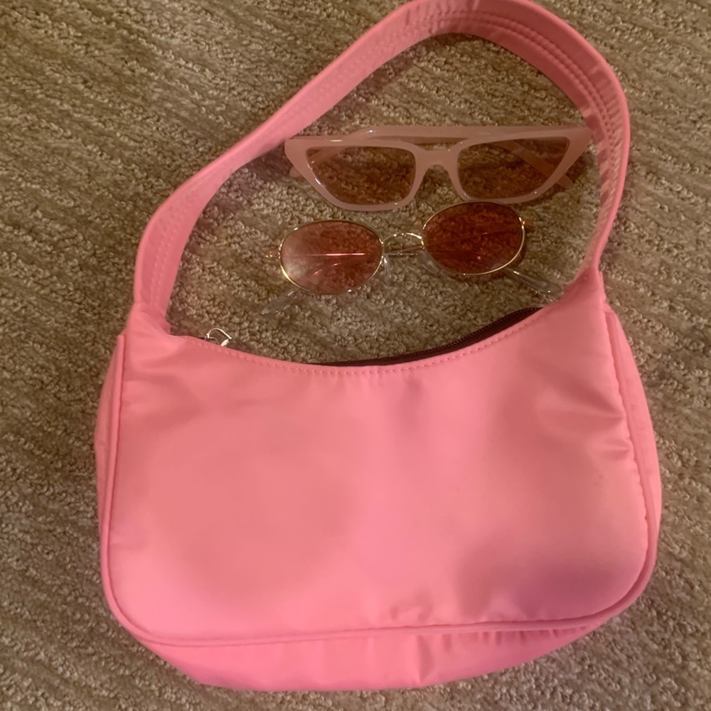 Pink purse and sunglasses